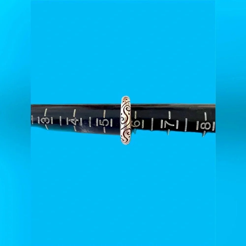 Sterling Silver Band Ring. Beautiful ring. Scroll work around ring. Size 6